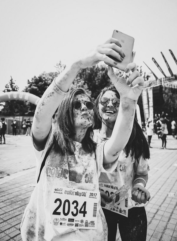 Two women runners taking muddy selfie after the Mud Runners Championship